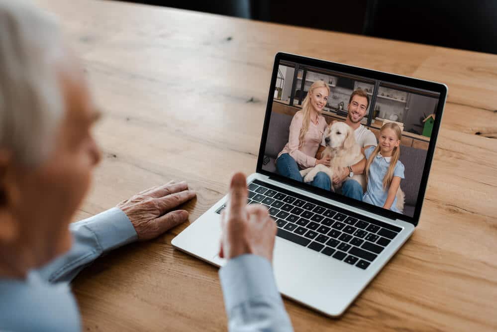 Grandpa having a video chat with his family during isolation