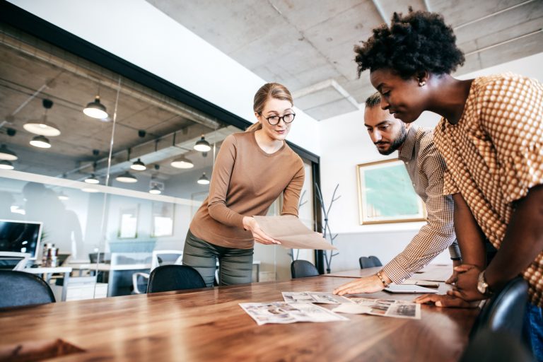 a marketing intern proposing her ideas during a team meeting