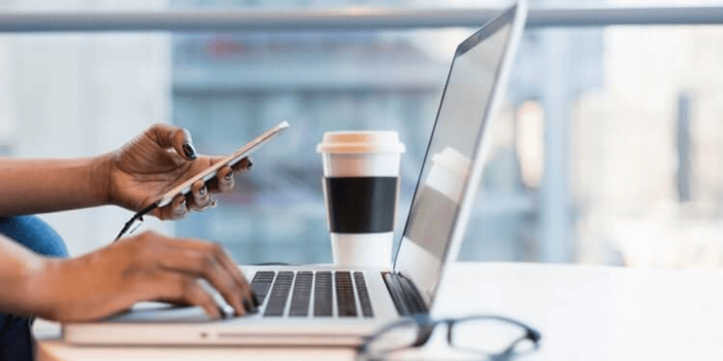 Closeup shot of a professional at work desk. Wondering, what's the best time to ask for a raise?