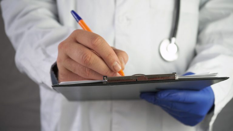 Entry level public health jobs recruiter using a tablet.