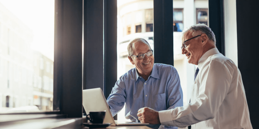 Men in their 50s chatting together.