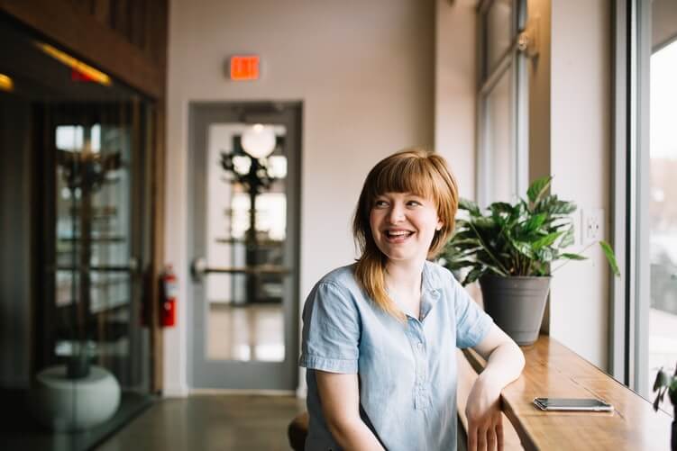 A colleague smiling at the workplace.