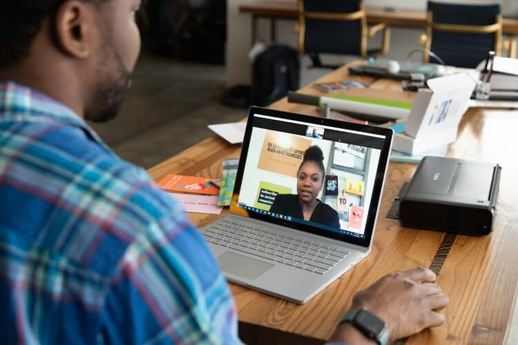 A professional holding his job interview via online.