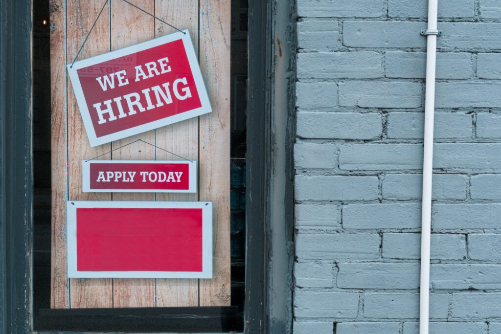 Image showcasing a fast-paced recruitment event, known as 'Speed Hiring', where numerous employers and prospective employees are engaged in rapid-fire interviews, symbolizing the swift and efficient nature of this modern recruitment process