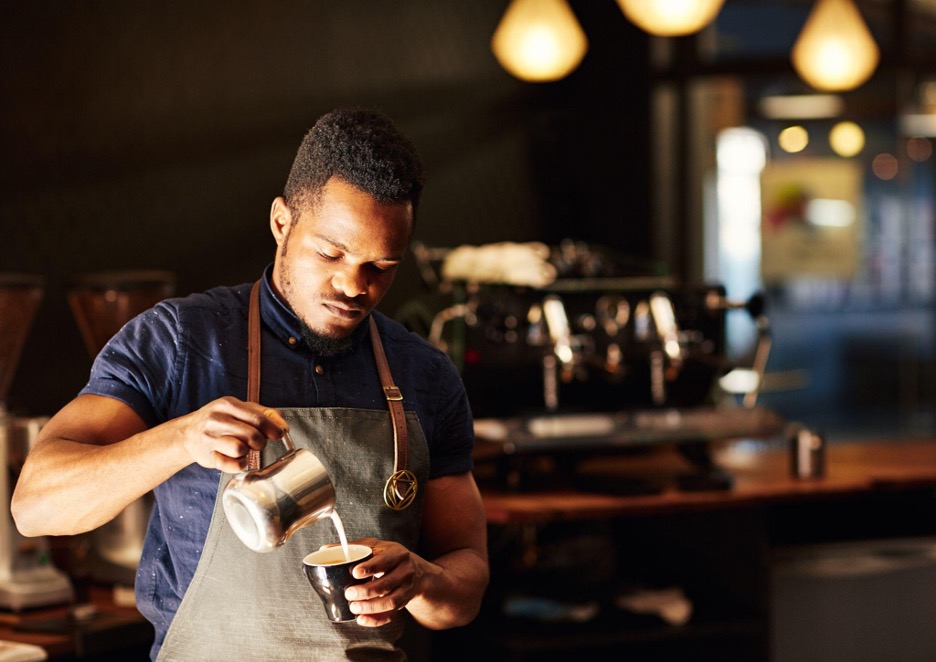 A barista on his part-time job